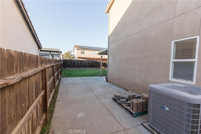 view of patio featuring a fenced backyard and central air condition unit