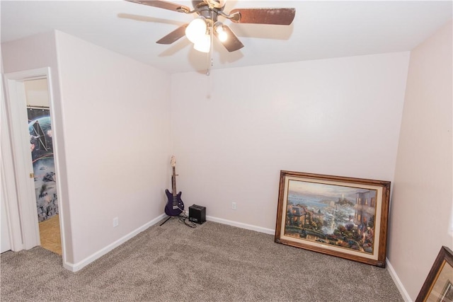 interior space with ceiling fan and baseboards