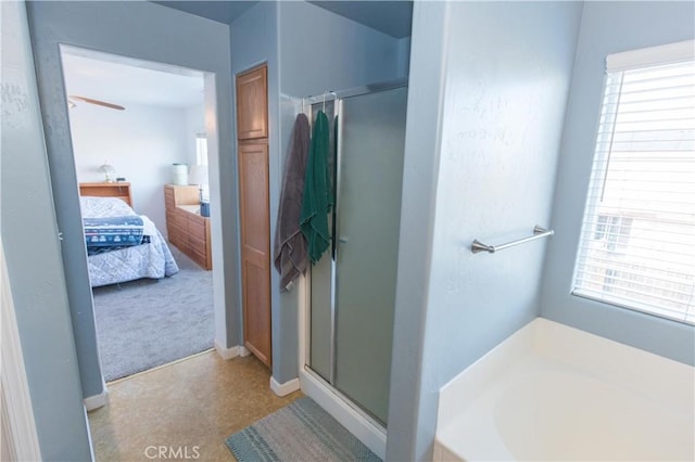 ensuite bathroom with a shower stall, plenty of natural light, and ensuite bathroom