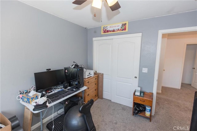 home office featuring ceiling fan, carpet, and baseboards