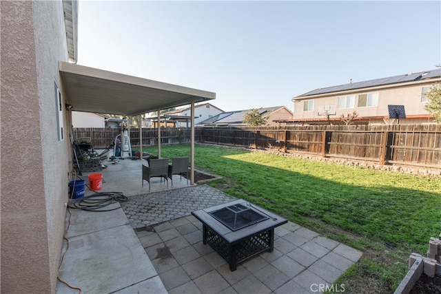 view of patio / terrace with an outdoor fire pit and a fenced backyard