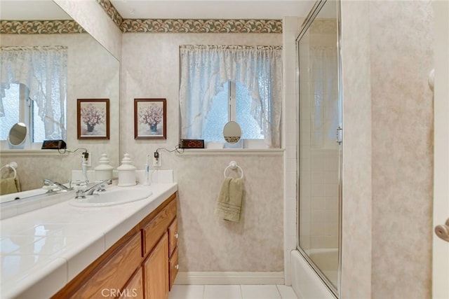 full bathroom with tile patterned flooring, enclosed tub / shower combo, and vanity