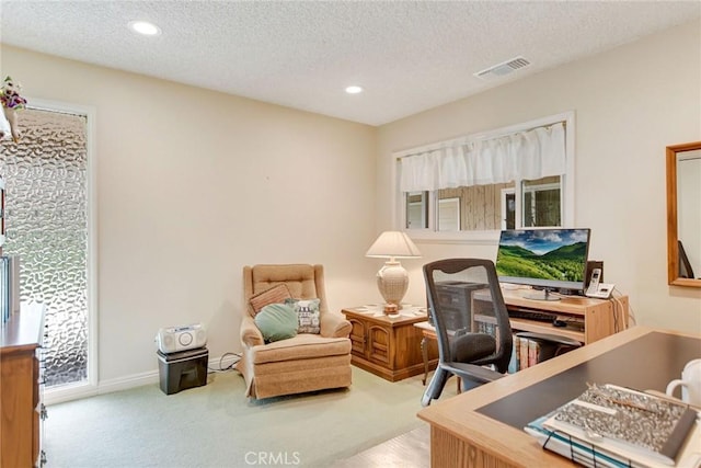 carpeted home office with recessed lighting, visible vents, a textured ceiling, and baseboards