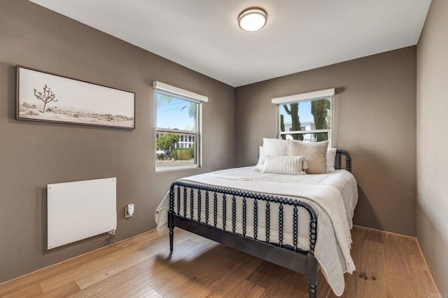 bedroom with wood finished floors