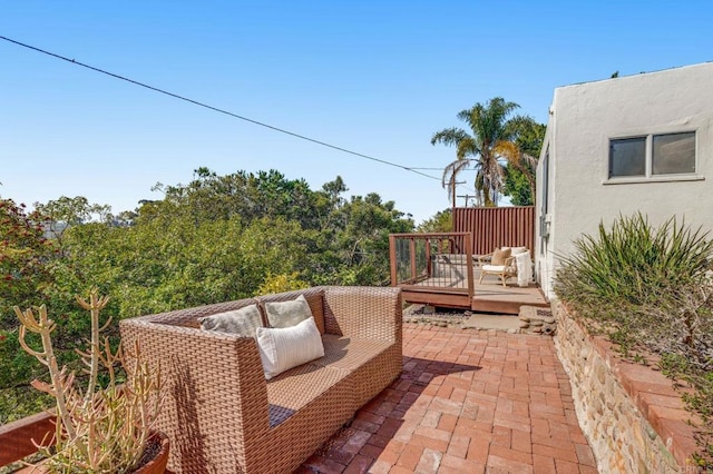 view of patio with a deck and an outdoor hangout area