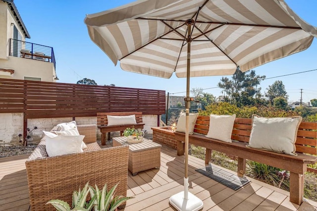 wooden terrace featuring an outdoor hangout area