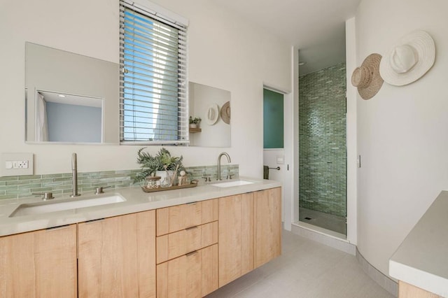 bathroom featuring double vanity, decorative backsplash, a sink, and a shower stall