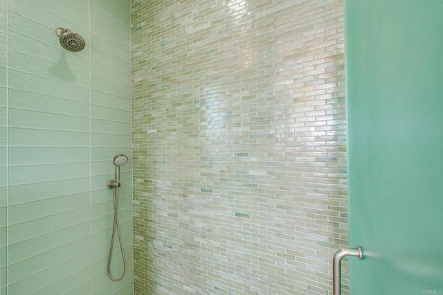 bathroom with a tile shower