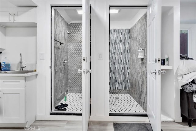 bathroom featuring a stall shower and vanity