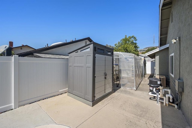 view of shed with a fenced backyard