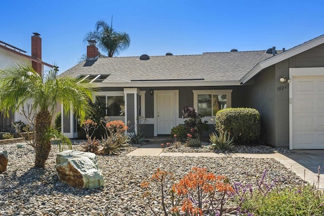 view of front of house with a shingled roof