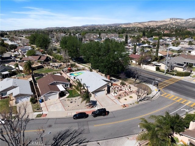 drone / aerial view with a residential view and a mountain view