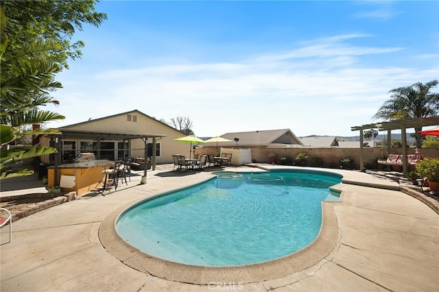 view of swimming pool with a fenced in pool, outdoor dry bar, a patio area, fence, and a pergola