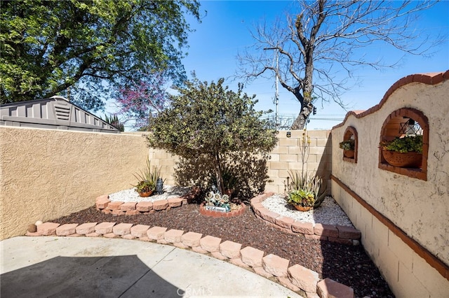 view of yard featuring a fenced backyard and a patio