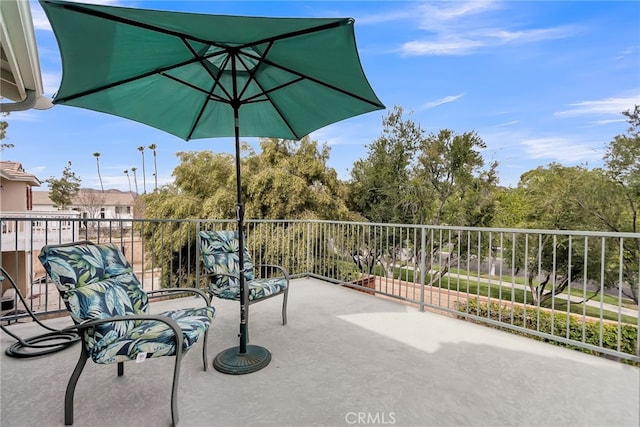 view of patio featuring a balcony