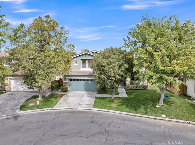 obstructed view of property featuring a garage, a front yard, concrete driveway, and brick siding