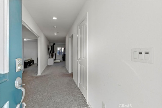 hallway with carpet floors and recessed lighting