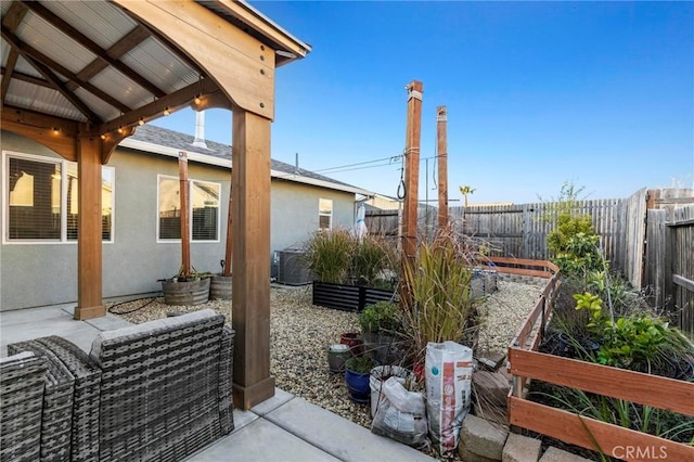 view of patio with a fenced backyard and a gazebo