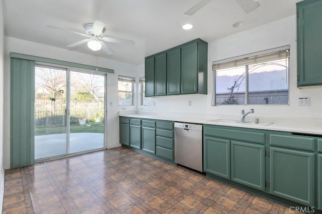 kitchen featuring a sink, a ceiling fan, green cabinets, and dishwasher