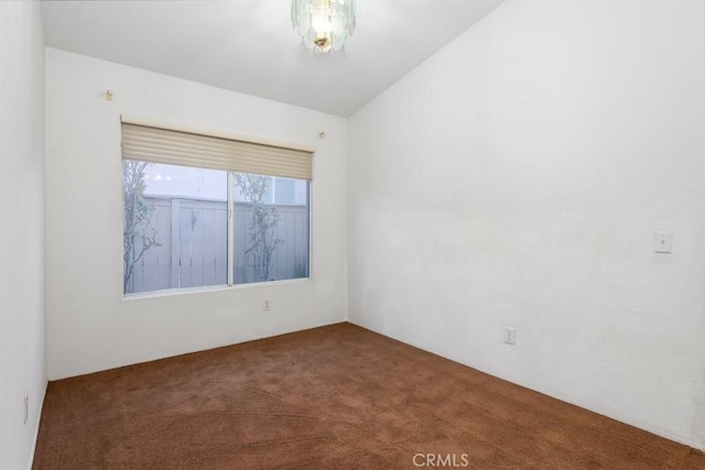 spare room featuring carpet floors