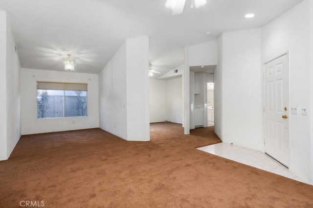 empty room with carpet floors and a ceiling fan