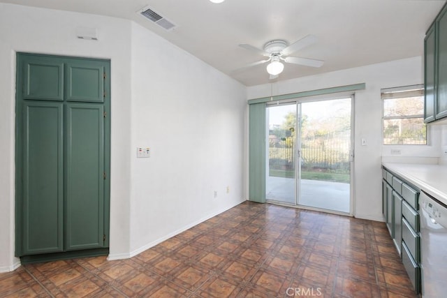 interior space featuring green cabinets, dishwashing machine, and visible vents