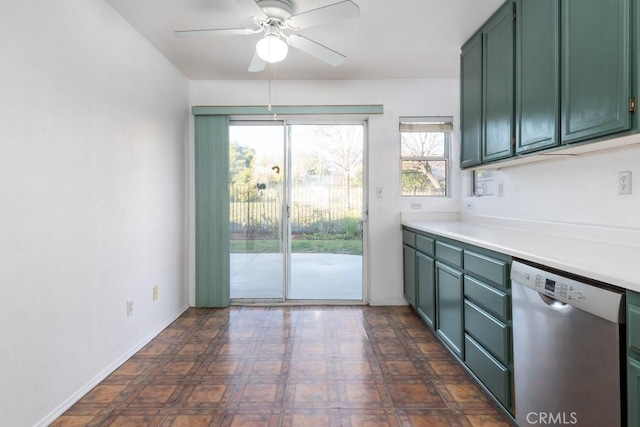 kitchen with a ceiling fan, green cabinets, stainless steel dishwasher, and light countertops