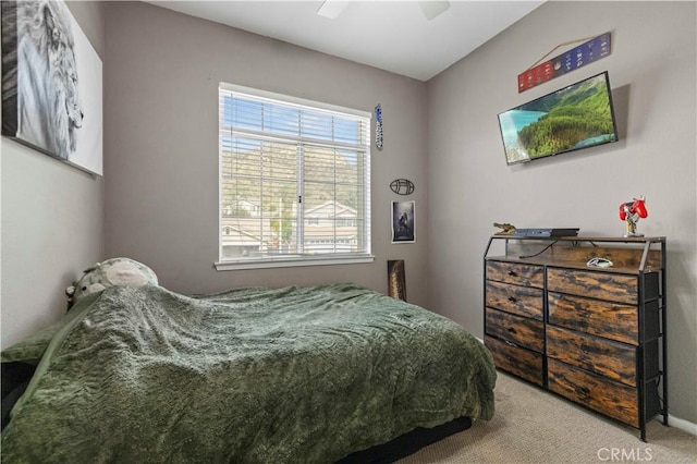 bedroom with ceiling fan and carpet floors