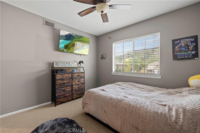 bedroom with carpet, visible vents, ceiling fan, and baseboards