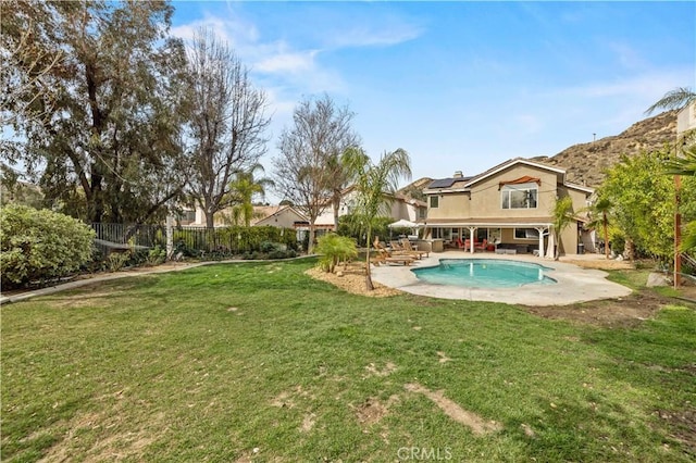 view of pool with a fenced in pool, a patio area, a yard, and a fenced backyard