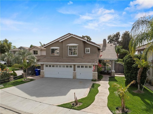 view of front of property with stone siding, a tile roof, an attached garage, a gate, and stucco siding