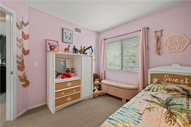 carpeted bedroom featuring visible vents and baseboards