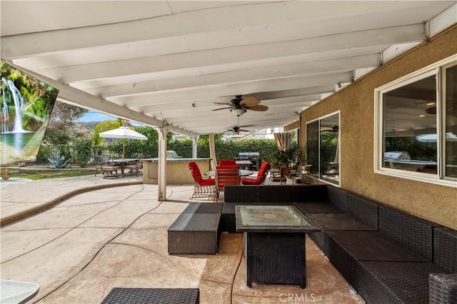 view of patio with an outdoor hangout area, outdoor dining space, and a ceiling fan