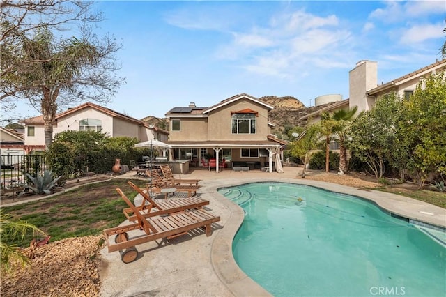 view of pool with a fenced in pool, a patio area, and a fenced backyard