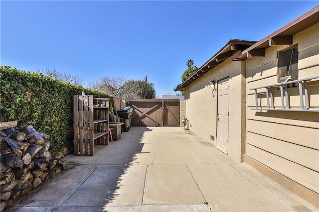 exterior space featuring a gate and fence