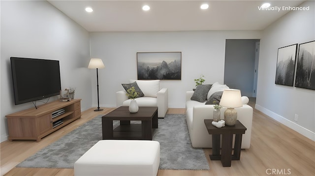 living area with light wood-style floors, recessed lighting, and baseboards