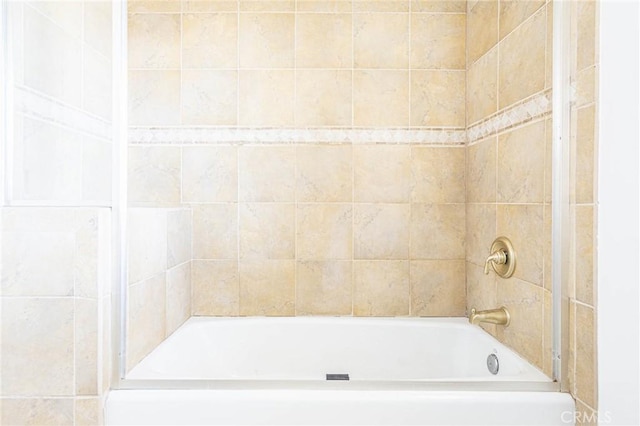 bathroom with shower / washtub combination