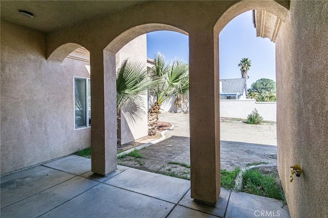 view of patio / terrace featuring fence