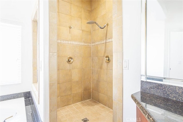 full bath with a stall shower and vanity