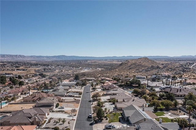 drone / aerial view featuring a residential view and a mountain view