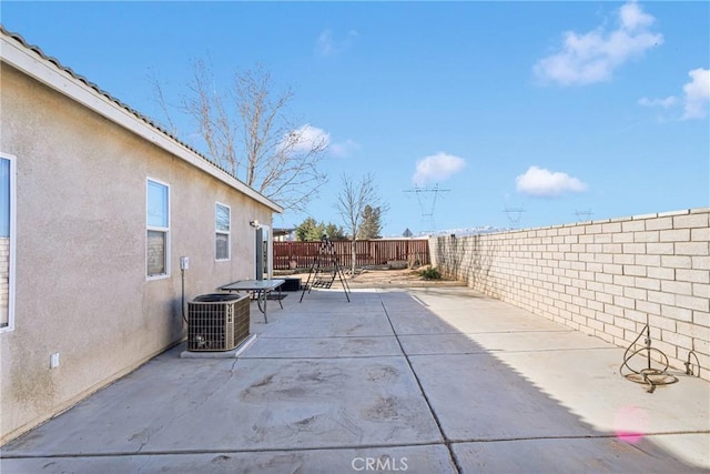 view of patio / terrace featuring a fenced backyard and cooling unit