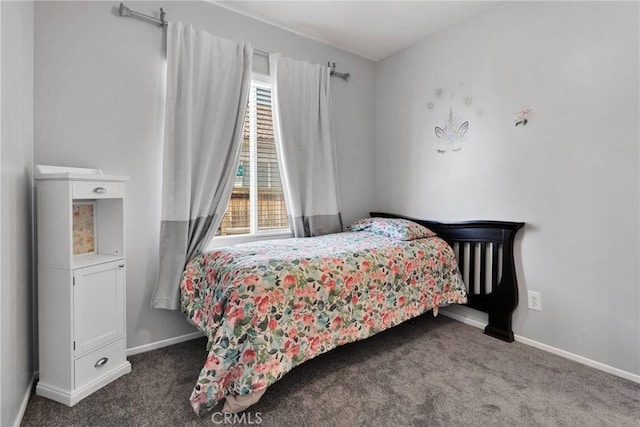 bedroom with carpet and baseboards