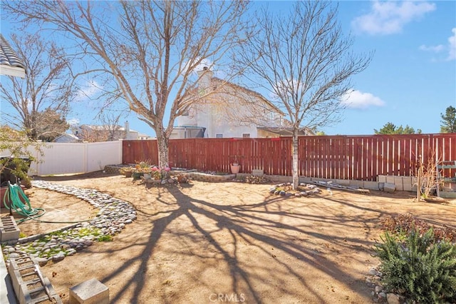 view of yard with a fenced backyard