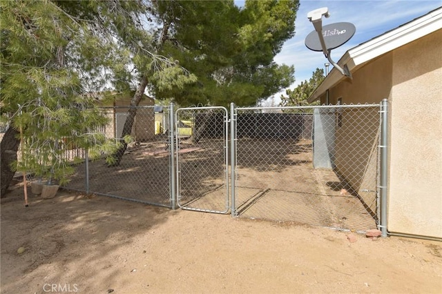 view of gate featuring fence