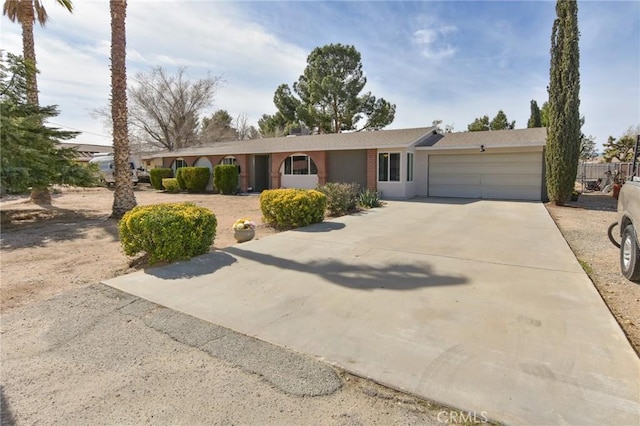 ranch-style home featuring driveway and an attached garage