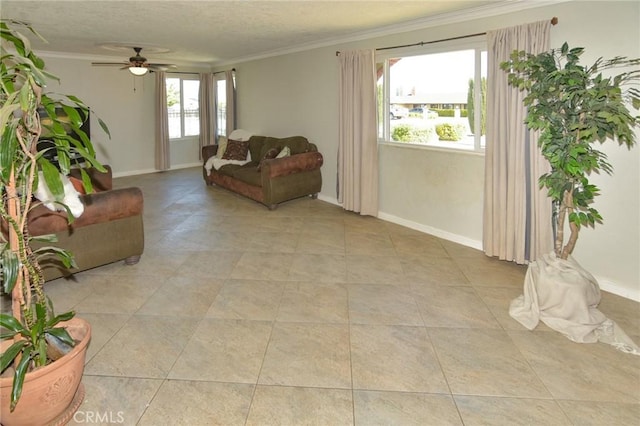 living room featuring a wealth of natural light, crown molding, and light tile patterned floors