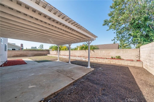 exterior space with a fenced backyard and a patio