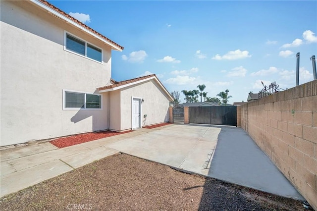 view of patio featuring fence