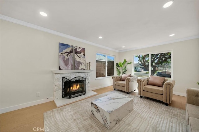 living room with baseboards and ornamental molding