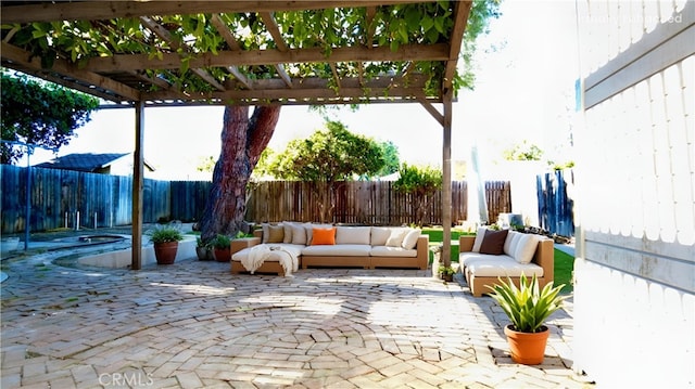 view of patio featuring an outdoor hangout area, a fenced backyard, and a pergola